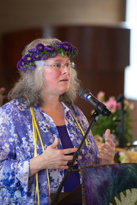 Image of Robin Brewer wearing flowers in her hair