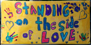 Image of a hand-painted Standing on the Side of Love poster