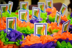 Image of bright orange, green and purple anniversary flowers