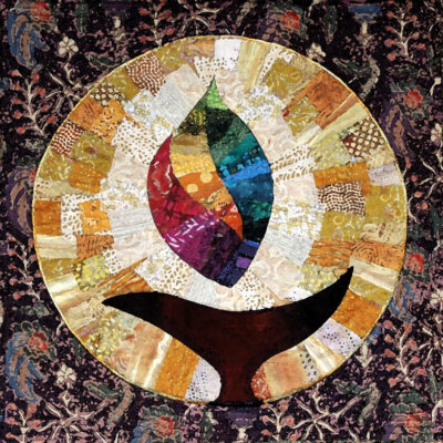 quilt illustration of flame over chalice in a circle pattern
