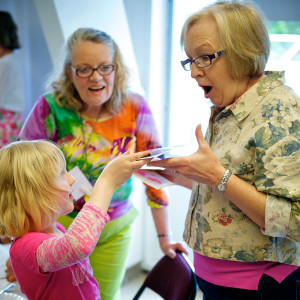 Image of adults and kids playing