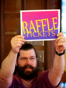 Member of the Seamsters holding up Raffle sign